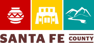 A logo for santa fe county shows a building mountains and a river
