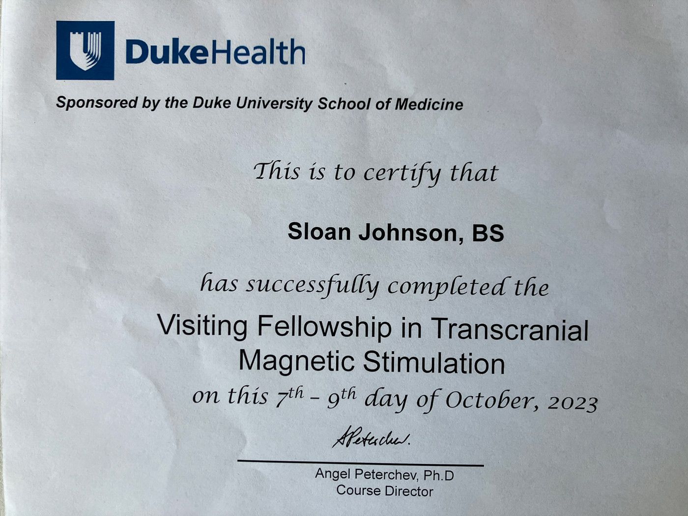 A duke health certificate that says sloan johnson has successfully completed the visiting fellowship in transcranial magnetic stimulation