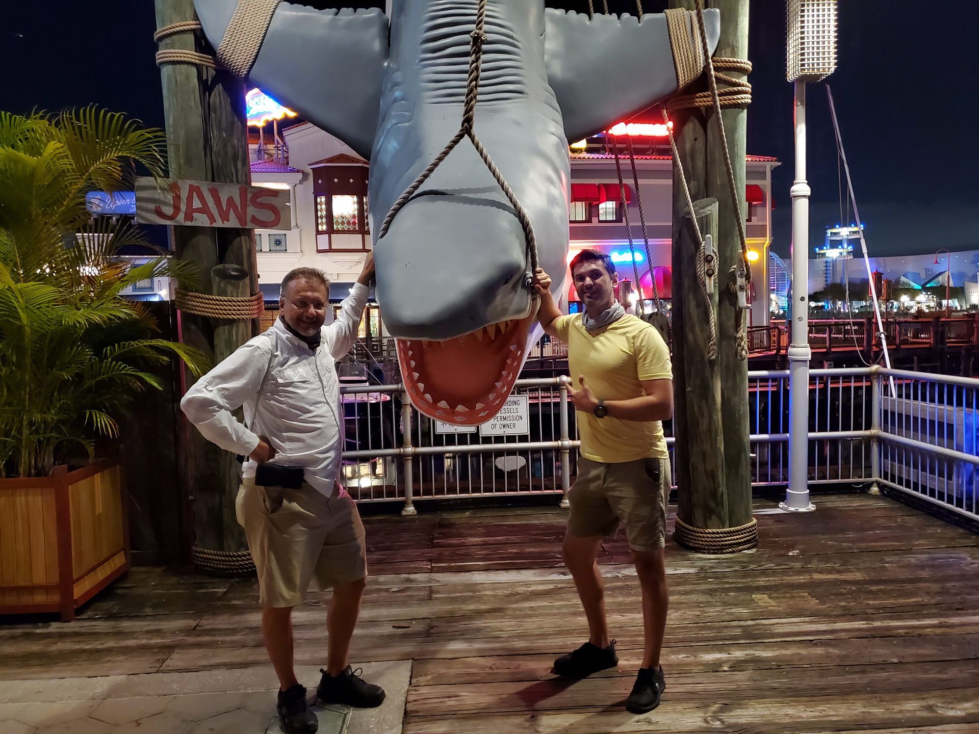 Owners of Heads Up Roofing standing in front of a statue Florida