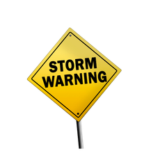 A yellow sign that says storm warning on it