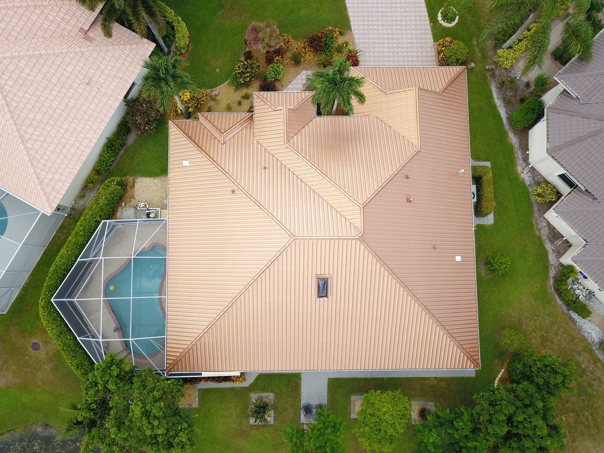 An aerial view of a signature house with a copper roof | Heads Up Roofing Florida #1 Roofing Contractor
