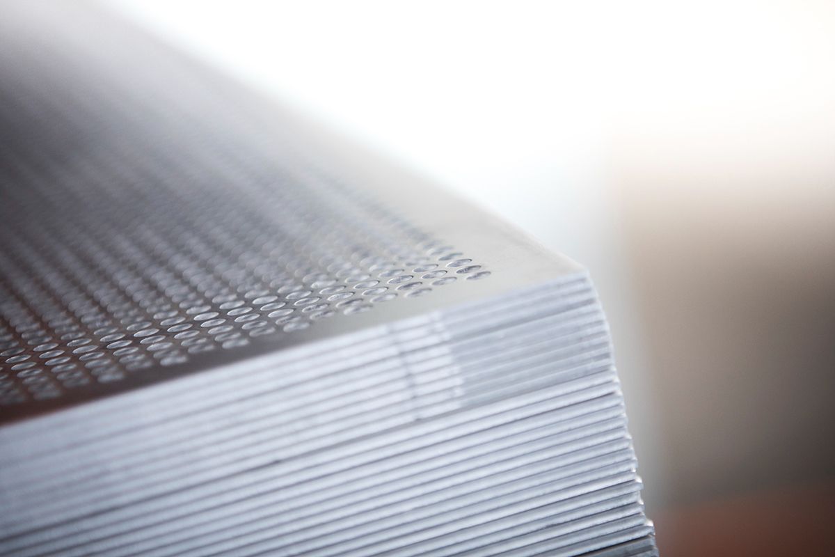 A close up of a stack of papers on a table — Sheet Metal Fabrication In Caloundra, Qld
