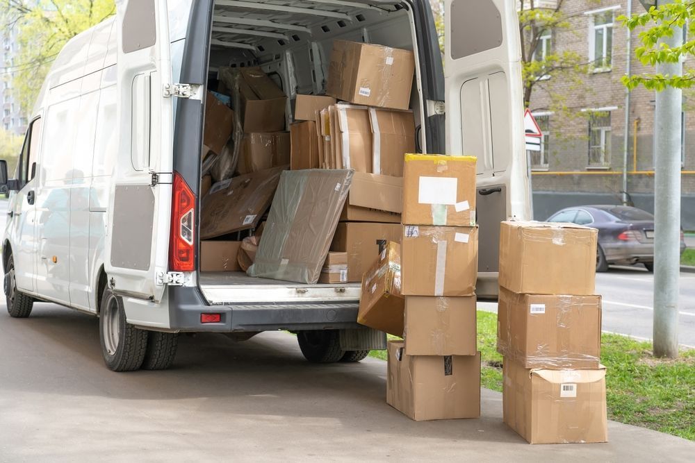 White Delivery Van with Open Back, Loaded with Boxes on A City Street — Barnes Transport and Removals in Ballina, NSW