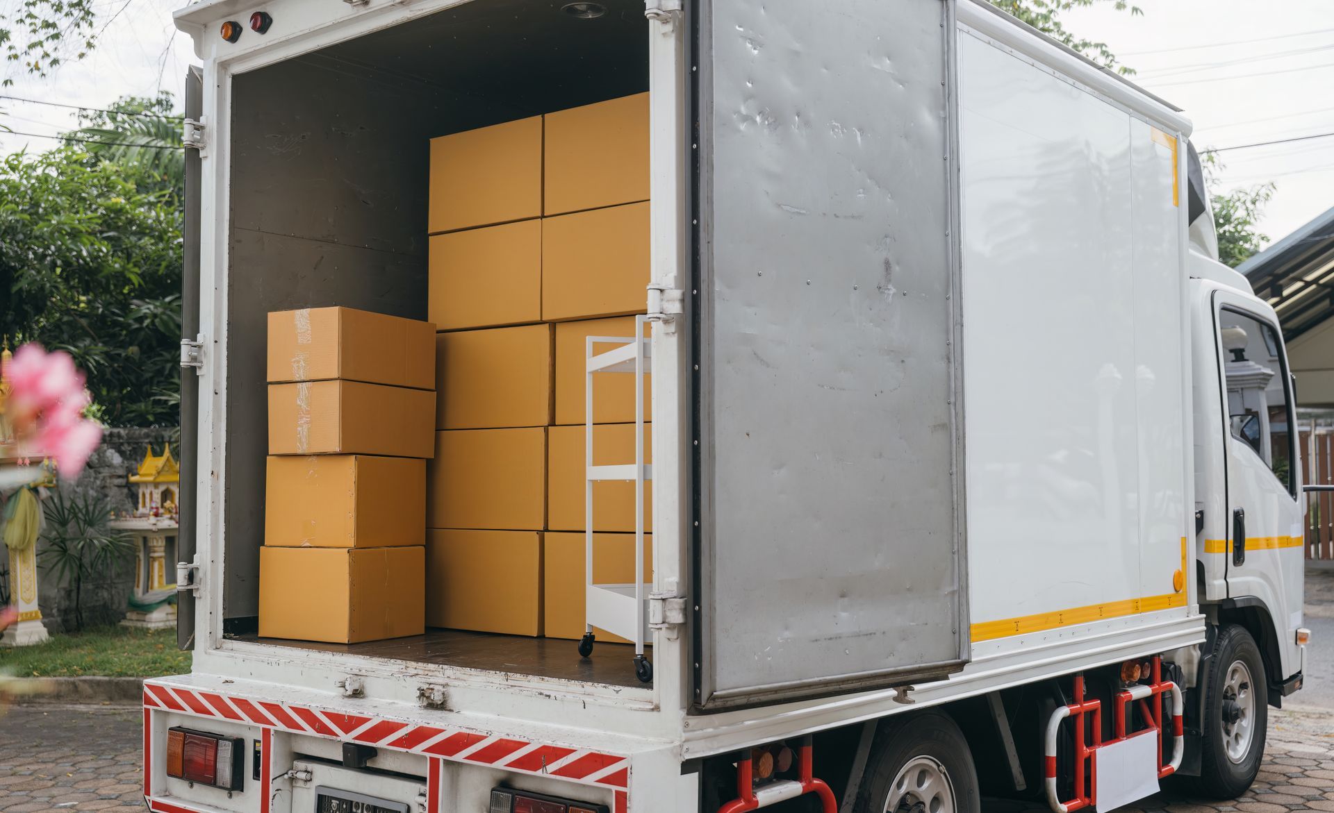 Delivery Truck with Open Back Door Loaded with Cardboard Boxes — Barnes Transport and Removals in Lismore, NSW