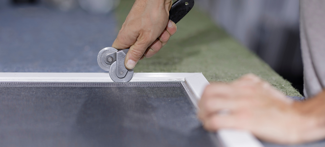 Corona Screen Repair technician installing new mesh on an existing sliding screen door frame