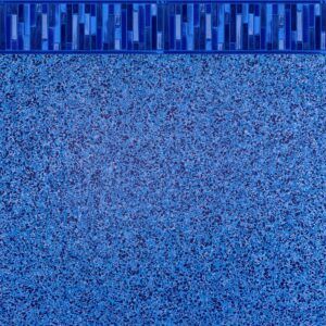 A close up of a blue swimming pool with a blue border.