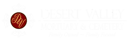 Red circular logo with gold script beside faint white text reading “Desert Valley Mortuary & Cemetery”