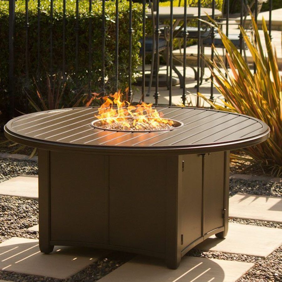 A round table with a fire pit in the middle