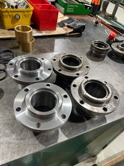 A bunch of metal parts are sitting on a table