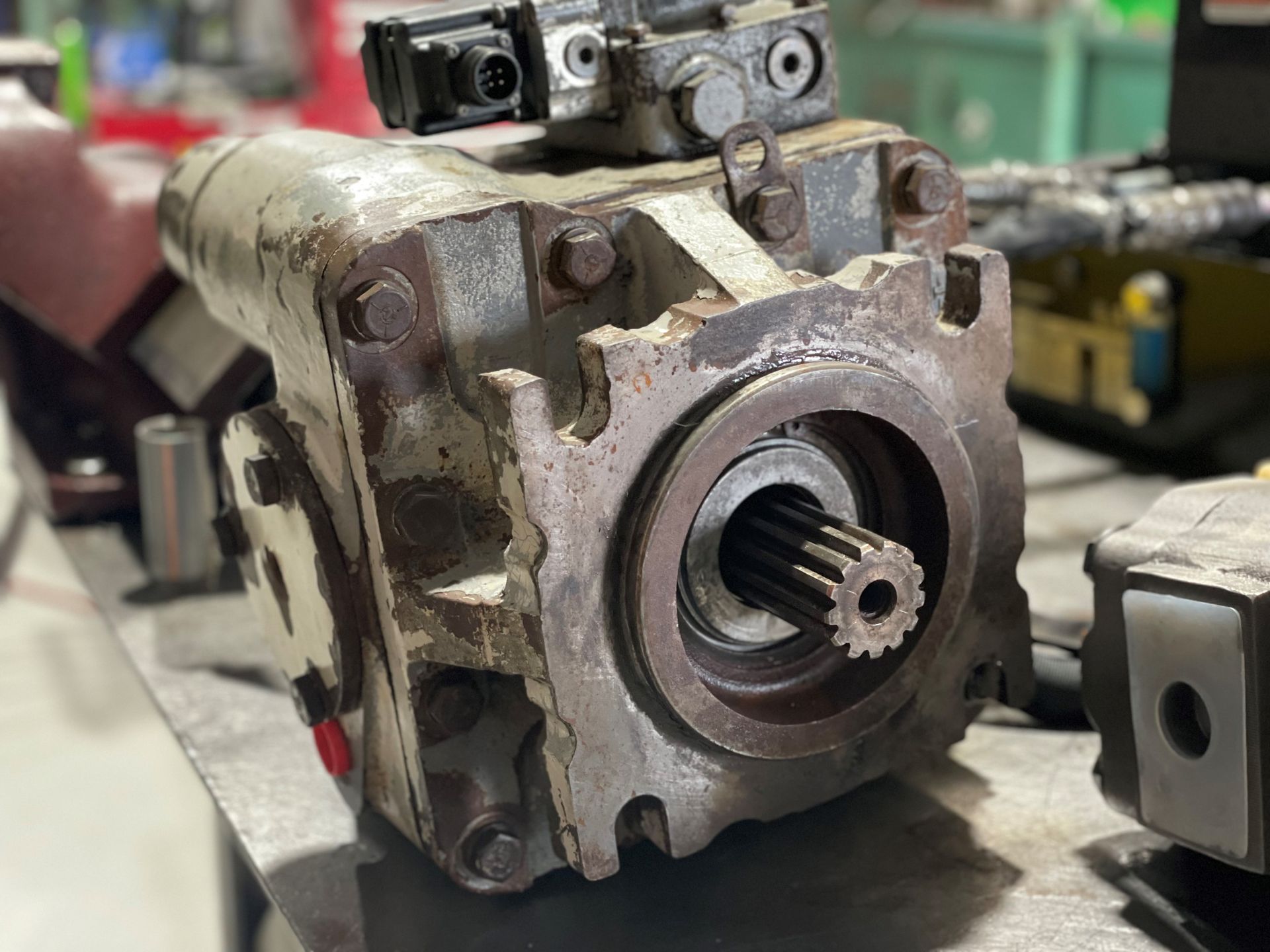 A close up of a hydraulic pump on a table.