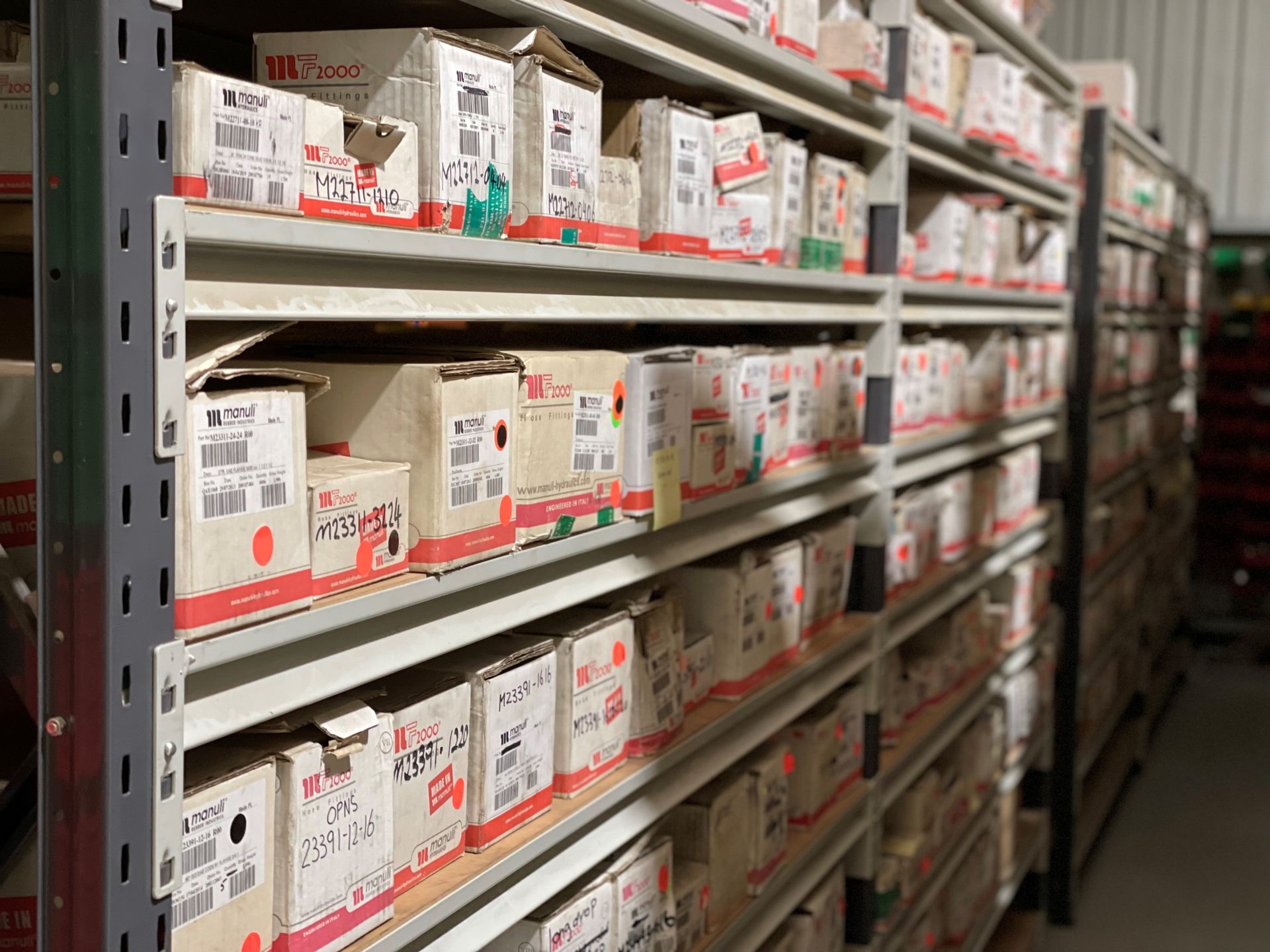A warehouse filled with lots of boxes on shelves