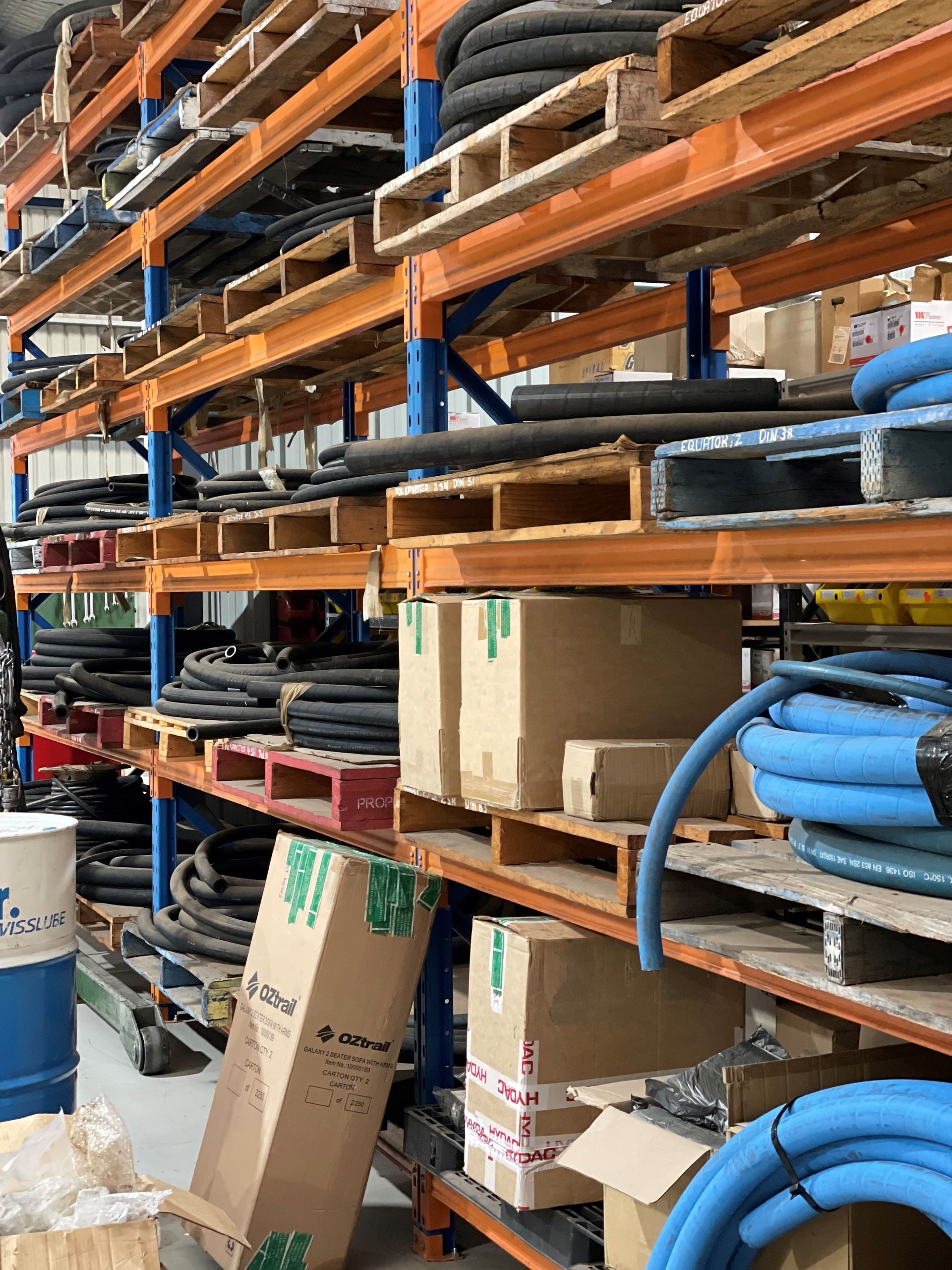A warehouse filled with lots of hose and boxes
