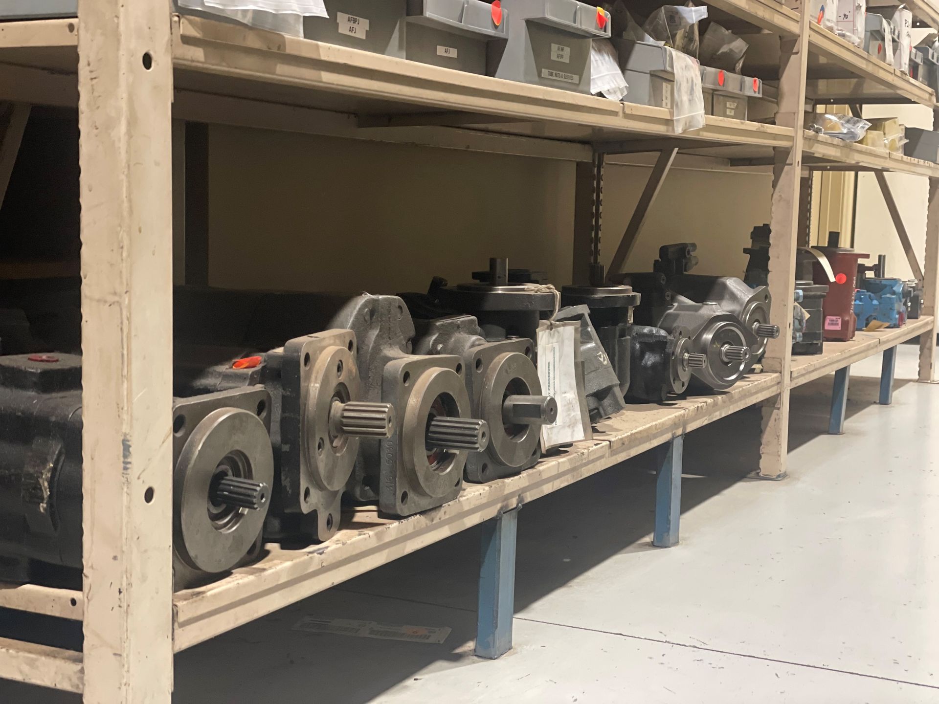 A warehouse filled with shelves filled with lots of parts.