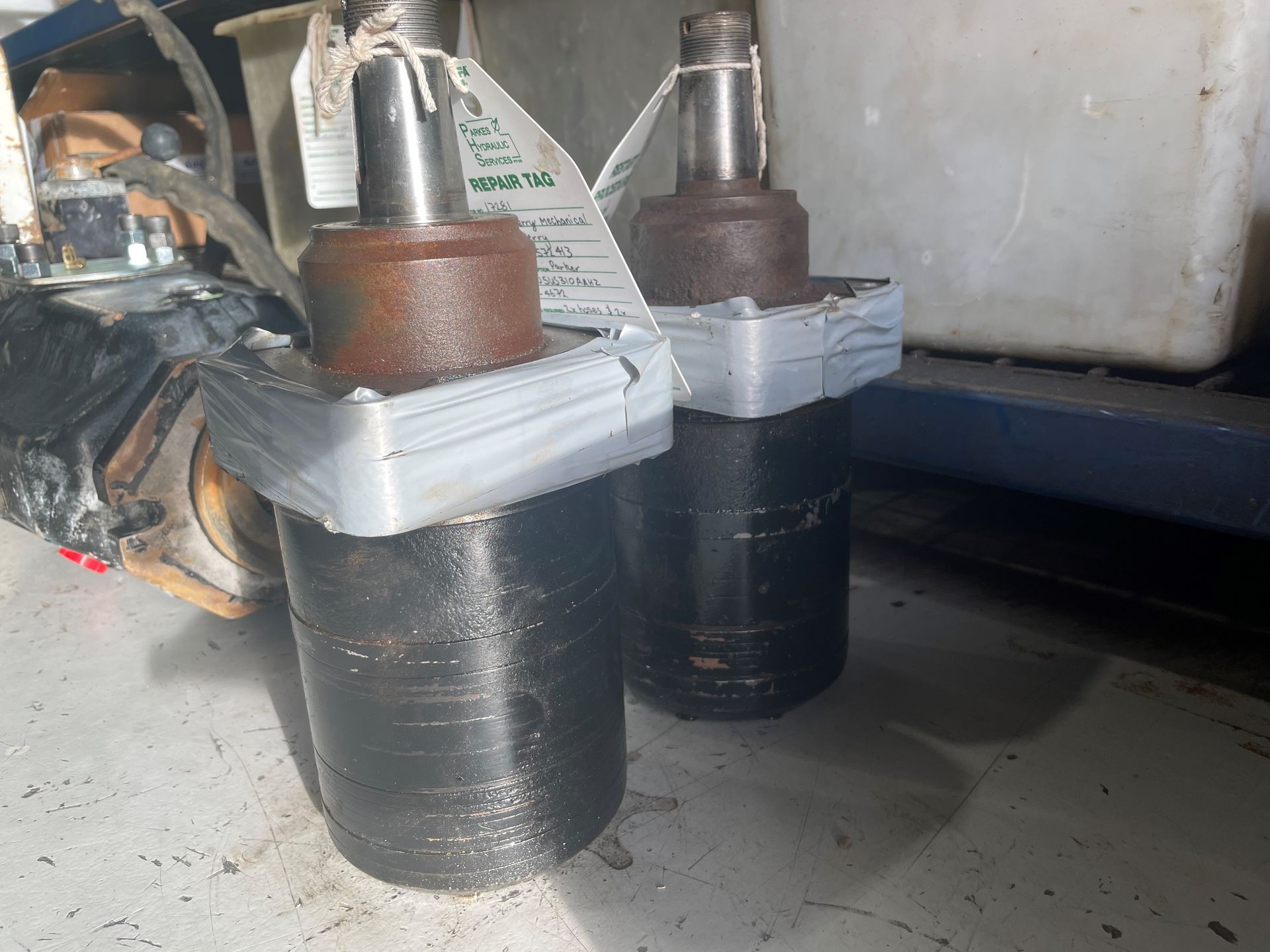 Two cylinders are sitting next to each other on a table.