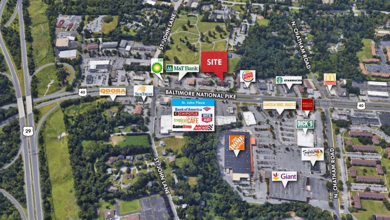 An aerial view of a shopping center with a lot of buildings.