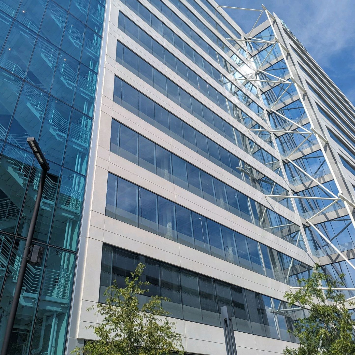 Image capturing the side profile of a sleek glass building's modern architecture