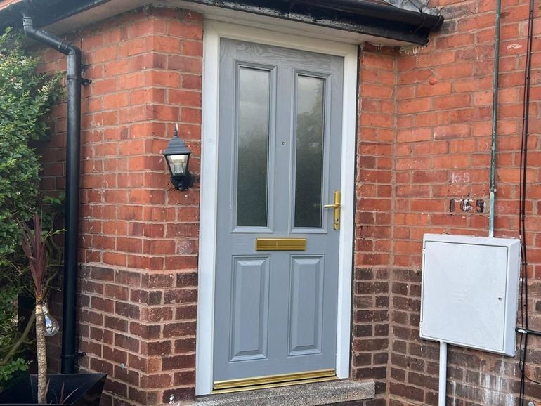 The same West Bridgford door after spraying light grey