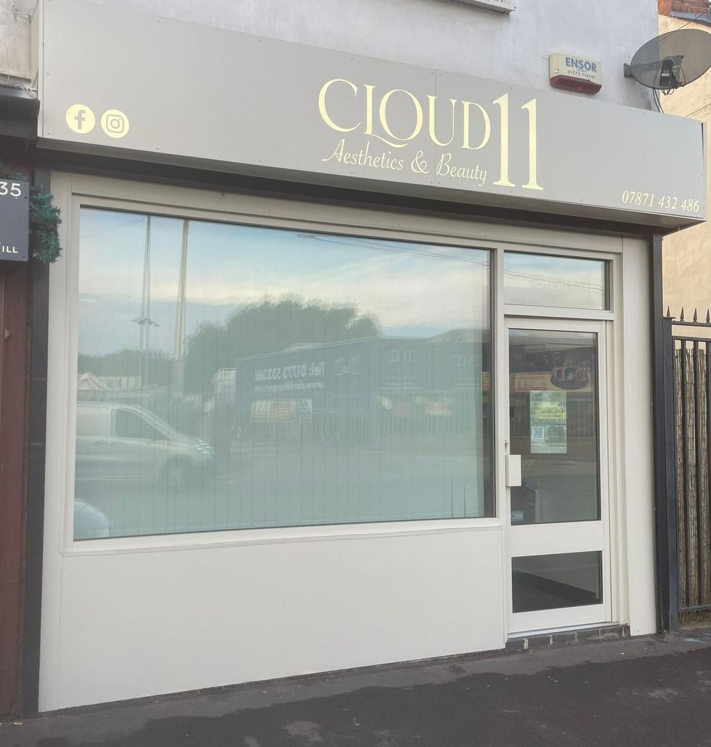 The same shop front after respraying the framing, door and fascia in Farrow & Ball Drop Cloth