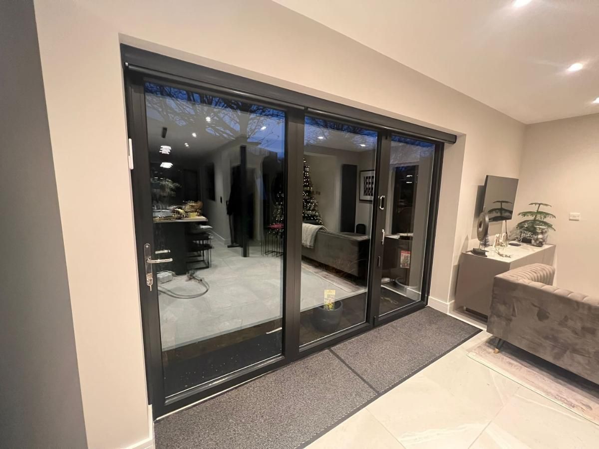 Spray Maestro after spray painting  conservatory bifold doors from white to black