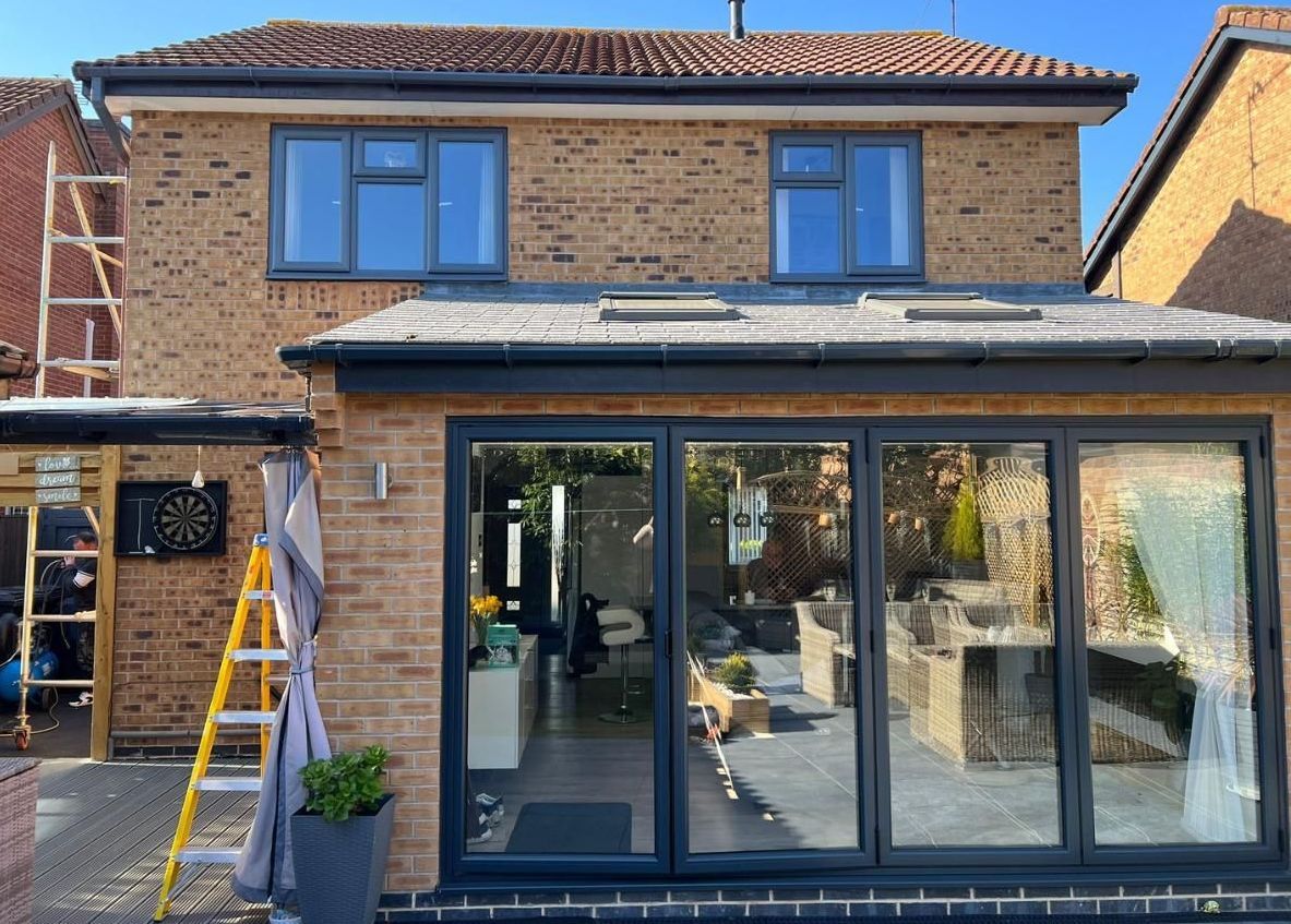 Spray Maestro after window spraying brown UPVC windows to charcoal grey