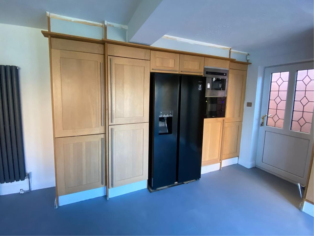 Kitchen cabinets before spray painting