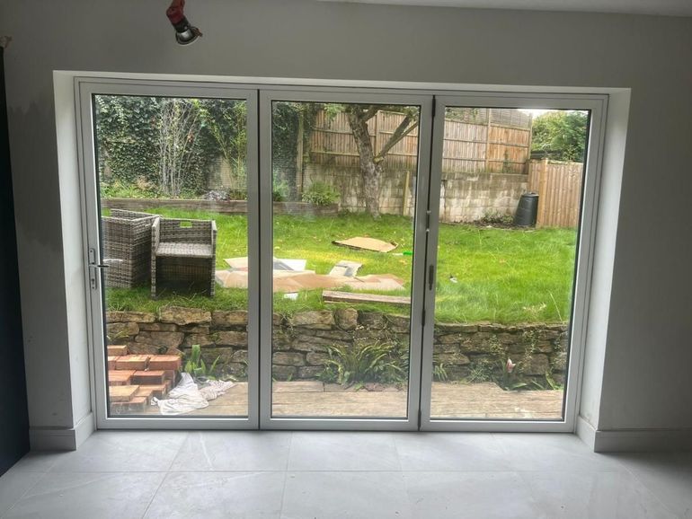 White uPVC bifold doors in Mapperley seen from inside before spraying