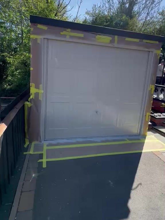 Garage door in Ashby-de-la-Zouch masked and sheeted, sprayed in a pale stone colour