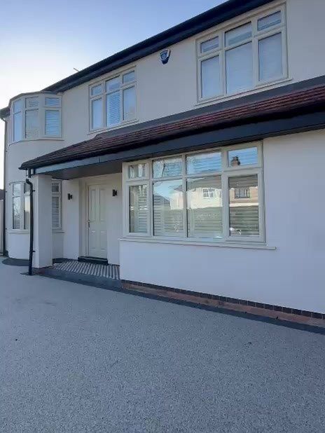 The Loughborough house after its uPVC windows and garage door were sprayed pale cream