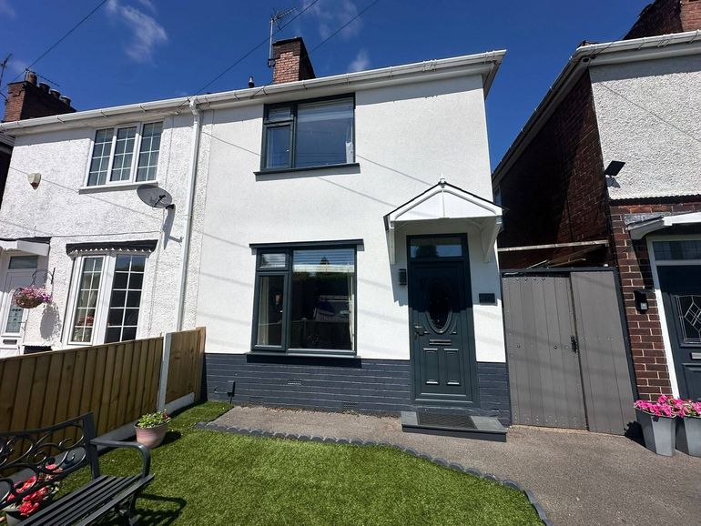 The same Sutton-in-Ashfield house after its uPVC windows and front door were sprayed anthracite grey