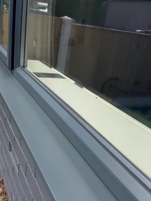 Close-up of a uPVC window frame and sill sprayed anthracite grey in Sutton-in-Ashfield