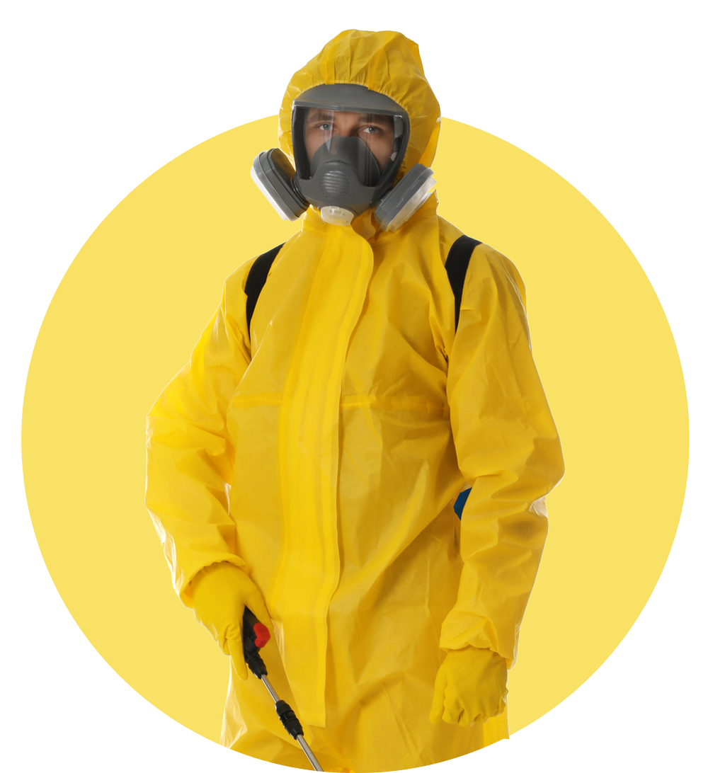 A man in a yellow protective suit and mask is holding a sprayer. A man in a yellow protective suit and mask is holding a sprayer.