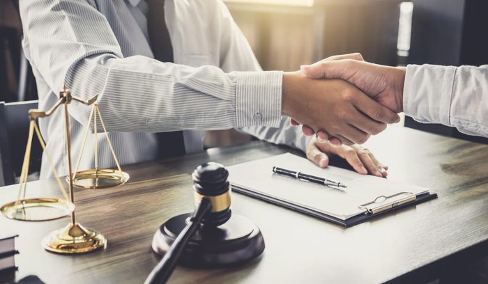 Lawyer Hand Shaking With Client — Goshen, NY — Owen Law Firm PLLC Lawyer Hand Shaking With Client — Goshen, NY — Owen Law Firm PLLC