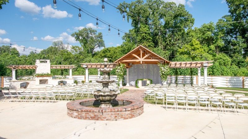 There is a fountain in the middle of the courtyard.