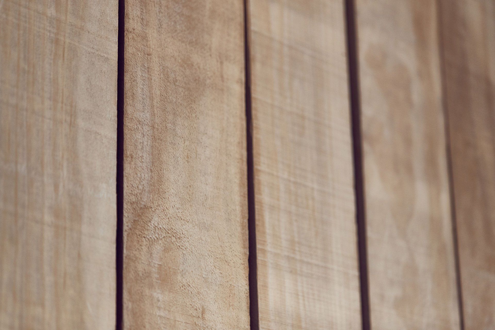 A close up of a wooden surface with a few lines on it.