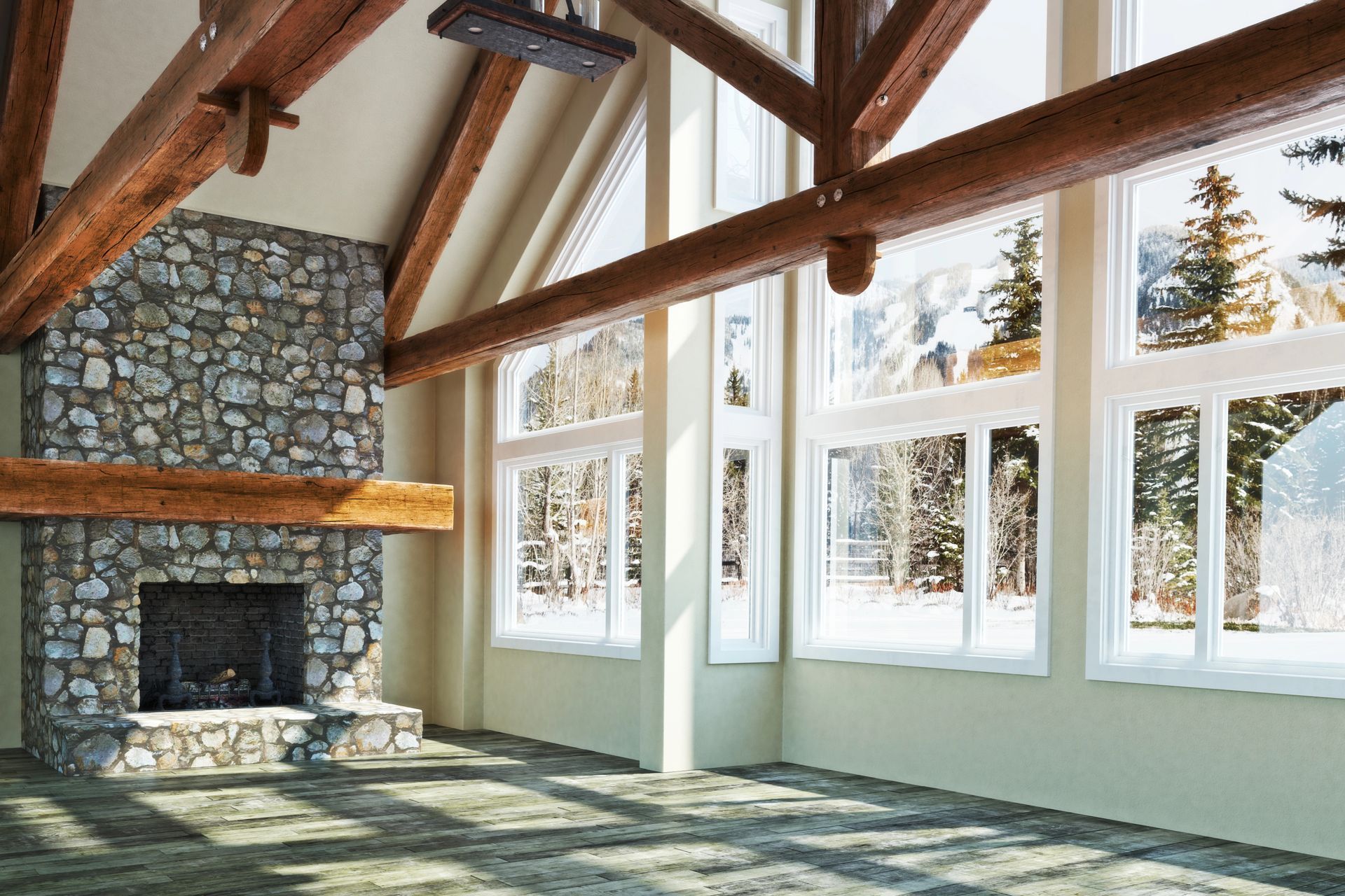 An empty room with a fireplace and lots of windows
