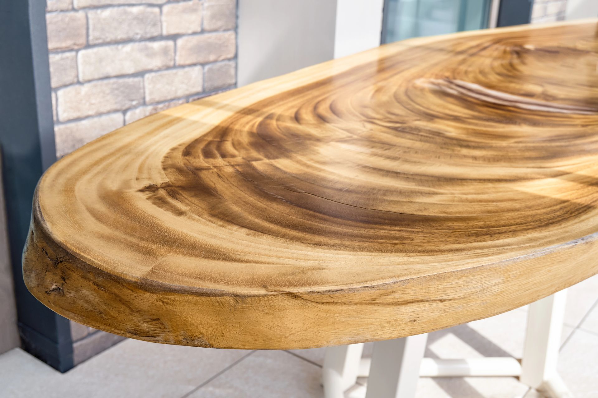 A close up of a piece of exotic wood table.