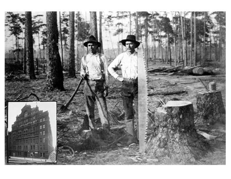 Two men with tools stand in a forest clearing. Building inset.