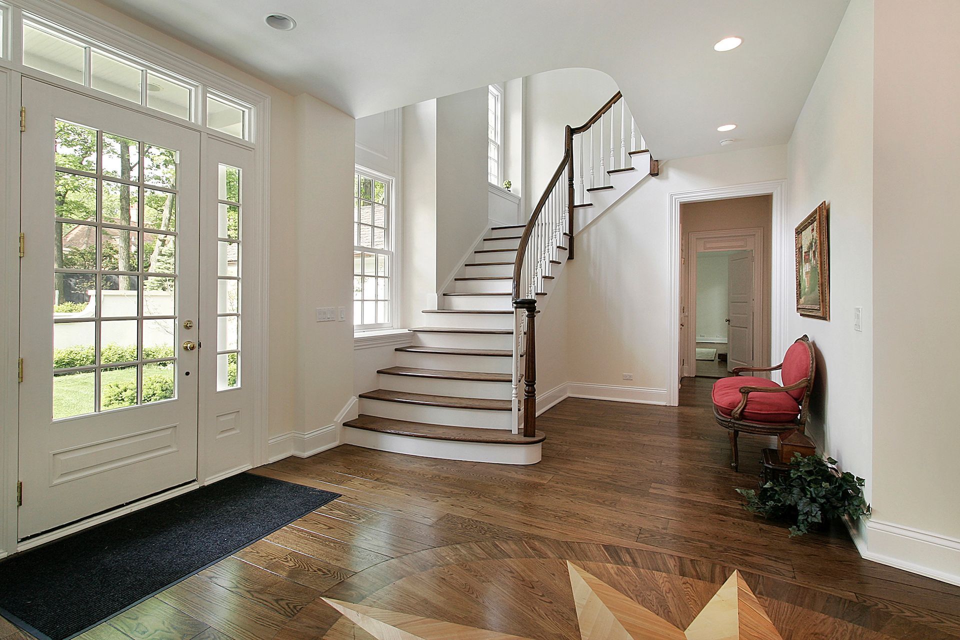 There is a staircase in the middle of the hallway.