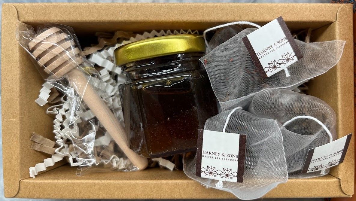 Beautifully packaged honey and tea gift set, perfect for holiday gifts.
