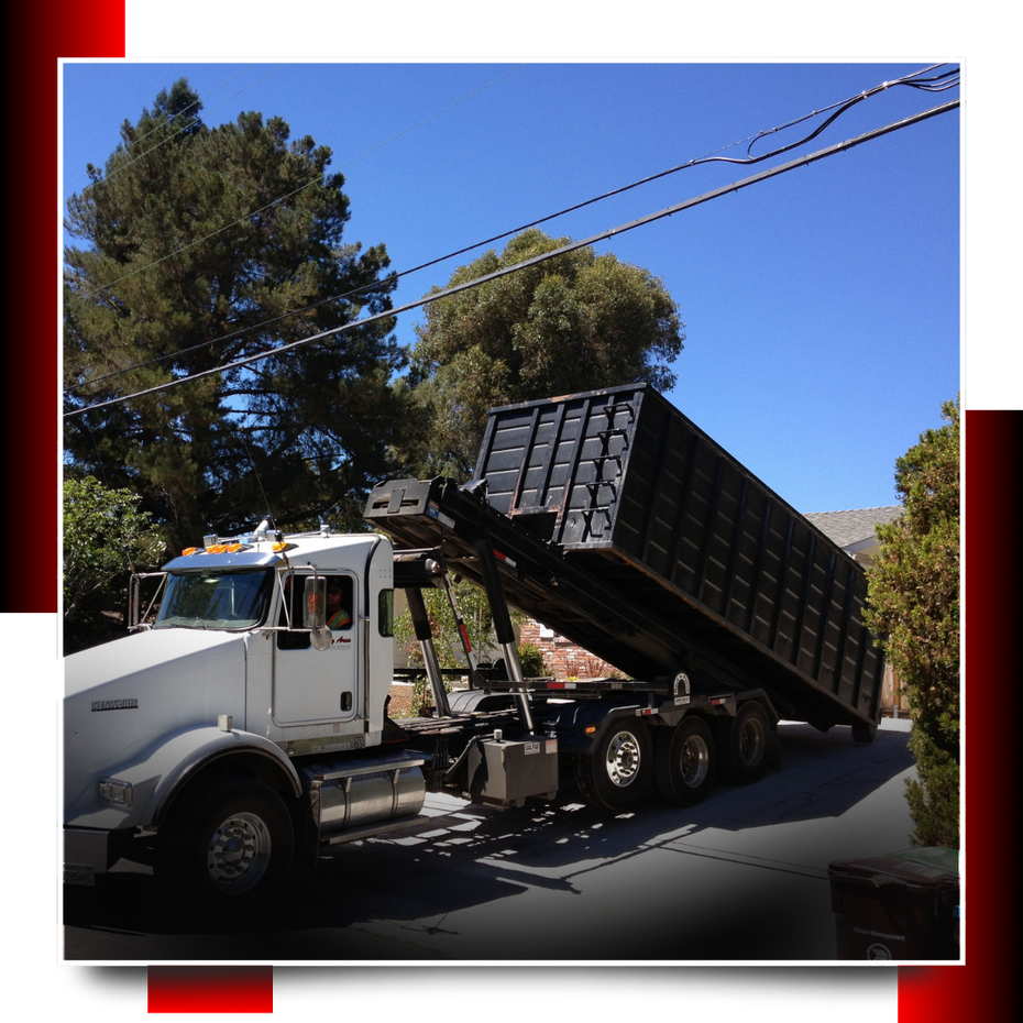 dumpster truck parked on the road