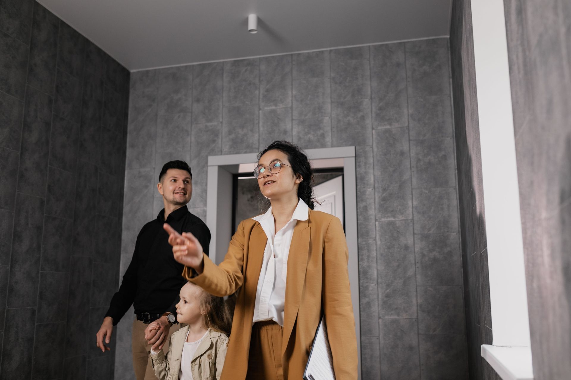 A family inspecting a house in Darwin and enquiring about