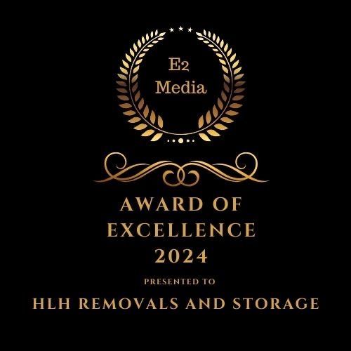 E2 Media “Award of Excellence 2024” plaque for HLH Removals and Storage on black background
