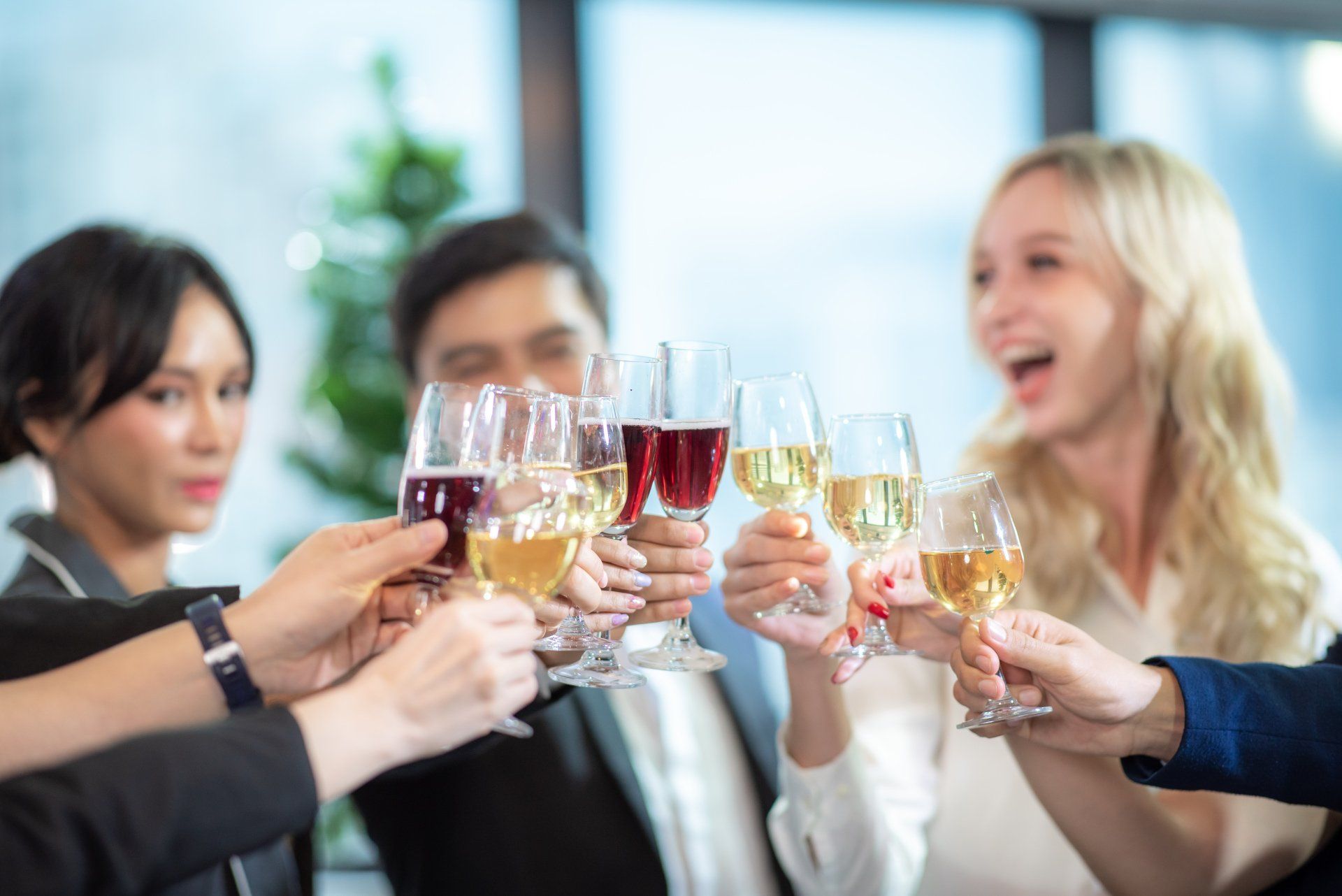a group of colleagues celebrating with wine