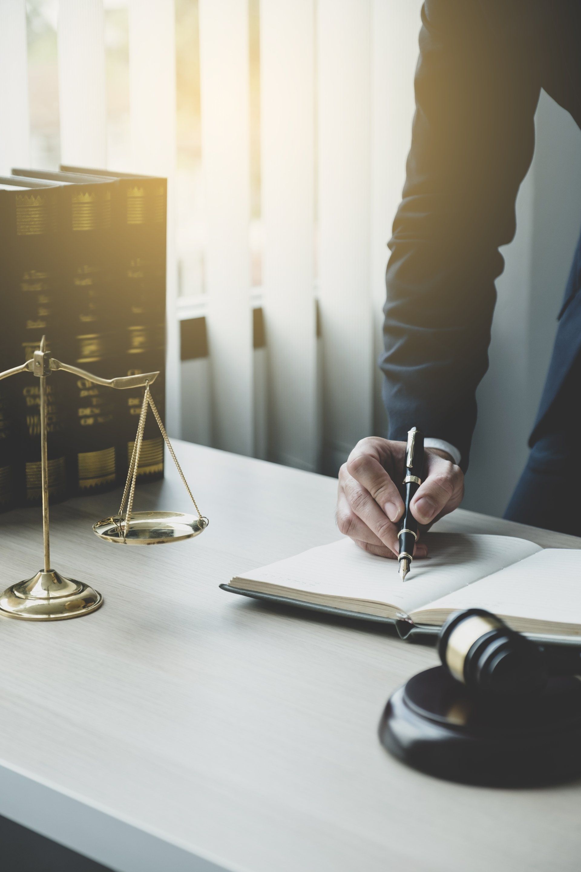 a lawyer writing in a book