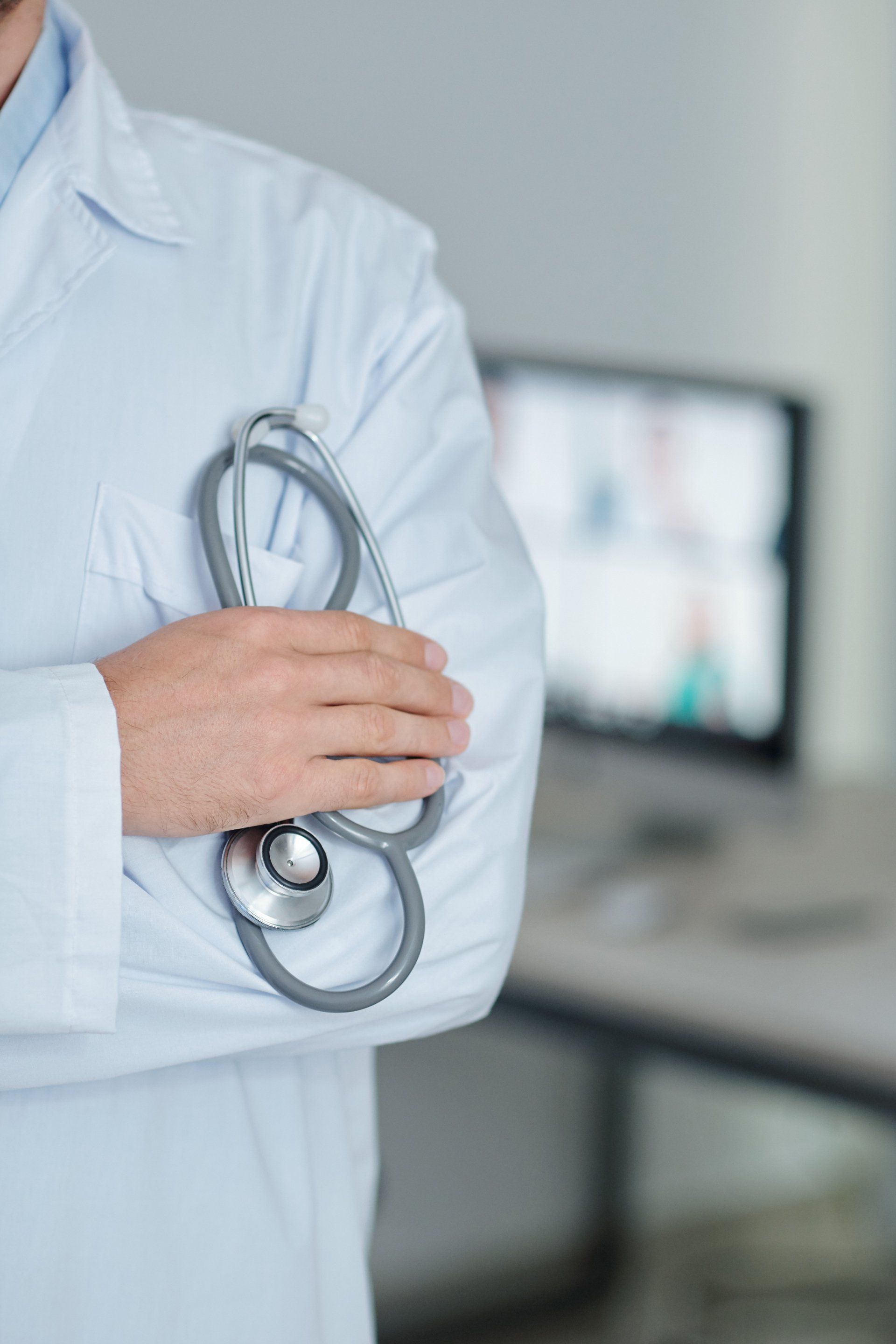 a physician holding a stethoscope