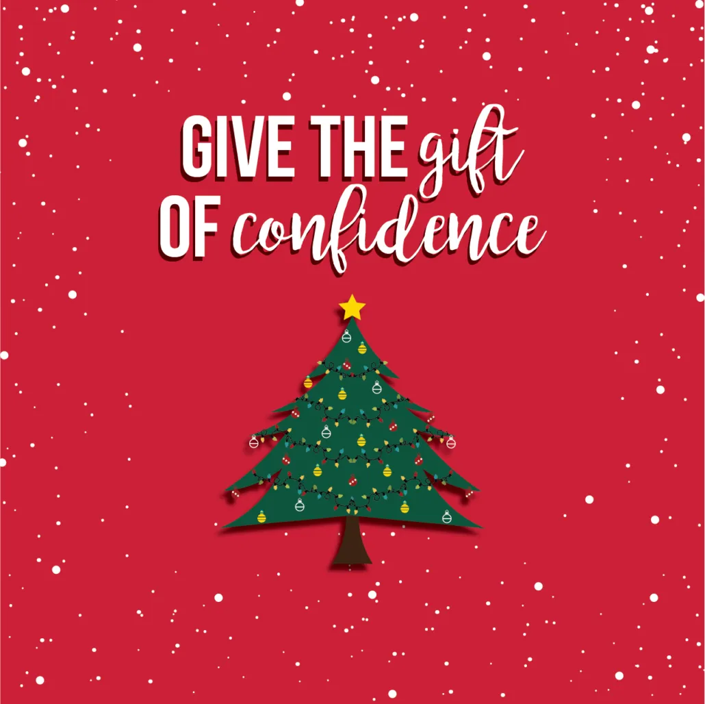 Red holiday card with a Christmas tree and the text “Give the gift of confidence”
