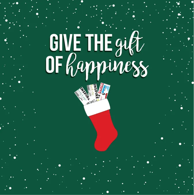 Text reading “Give the gift of happiness” above a red Christmas stocking on a green snowy background