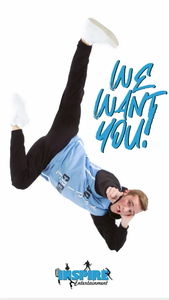 Dancer in blue and black outfit upside down with “WE WANT YOU!” text on white background