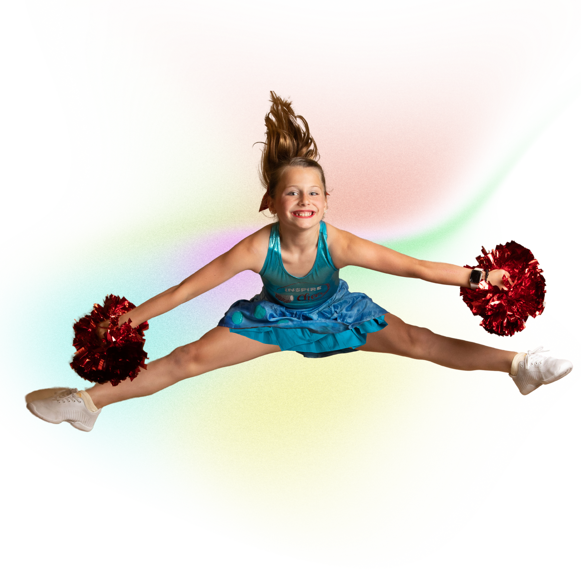 Cheerleader in blue outfit doing a full split midair with red pom-poms on a white background