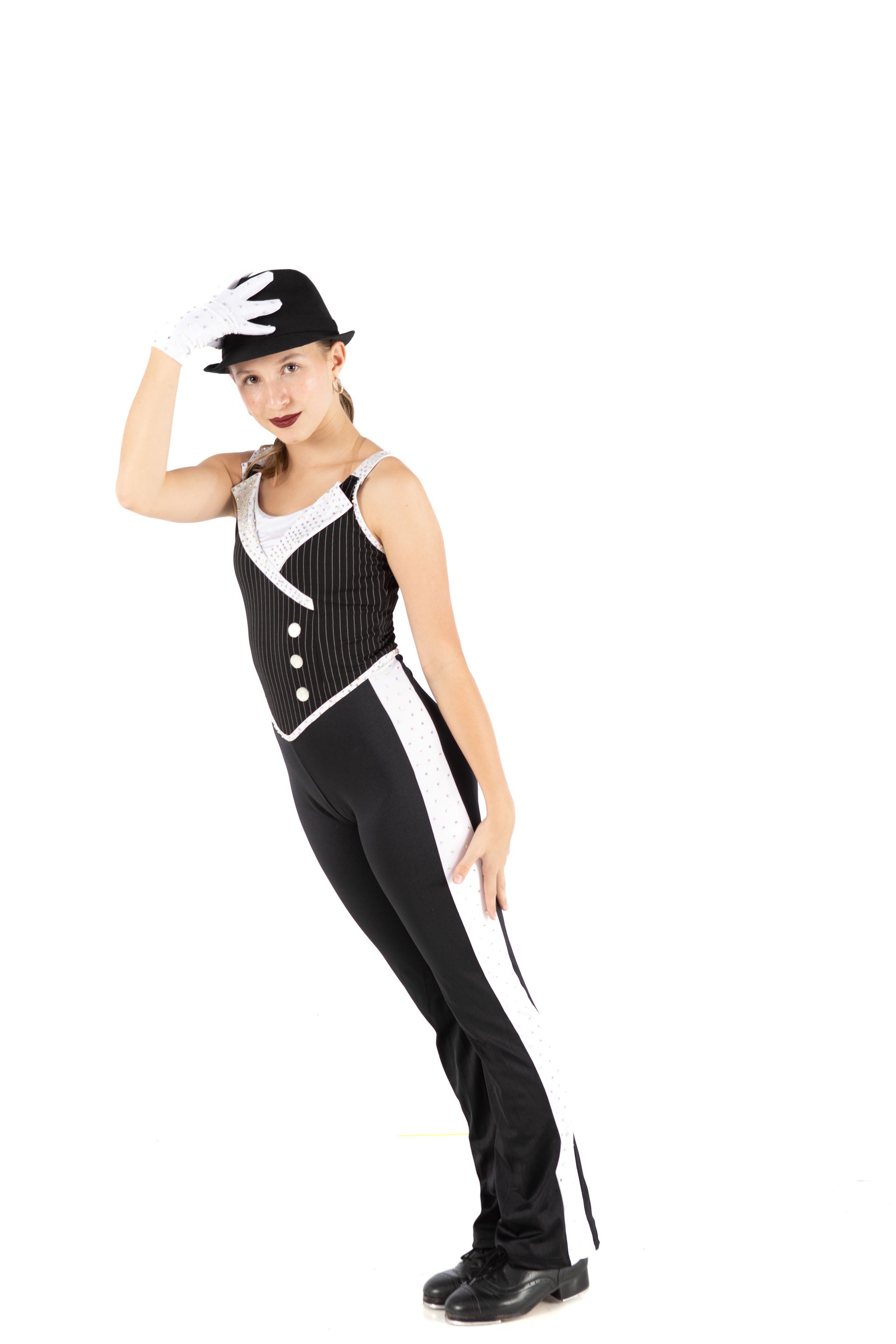 Person in a black outfit and cap posing against a white background.